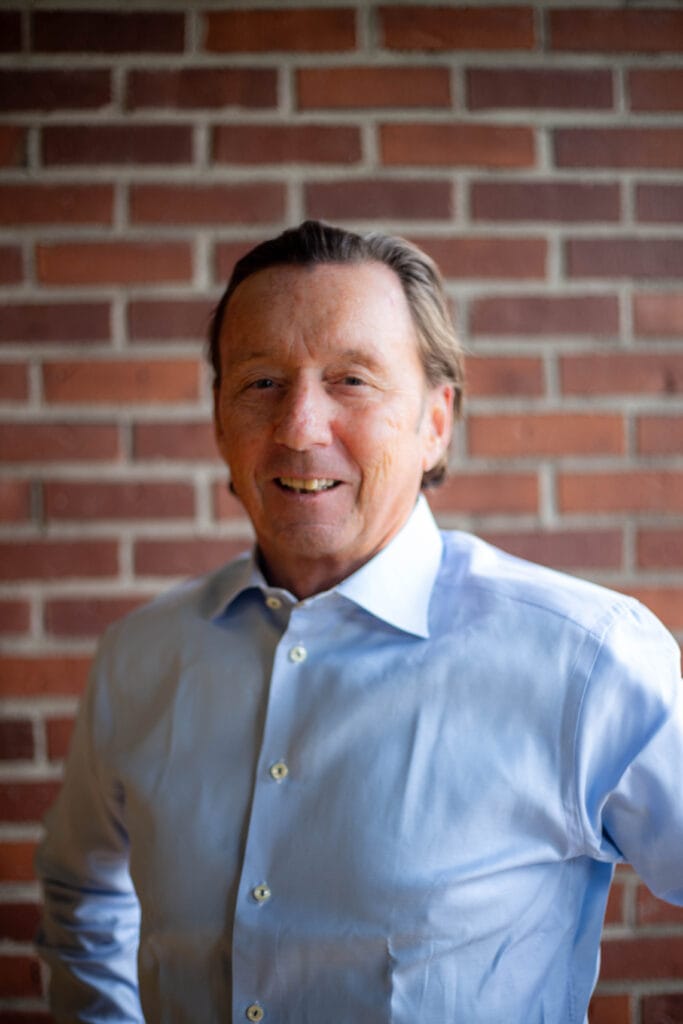 Smiling man in blue shirt
